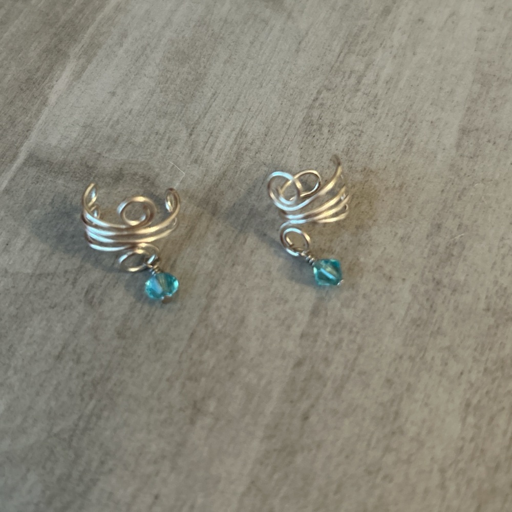 Elegant Silver Spiral Earrings with Blue Accent